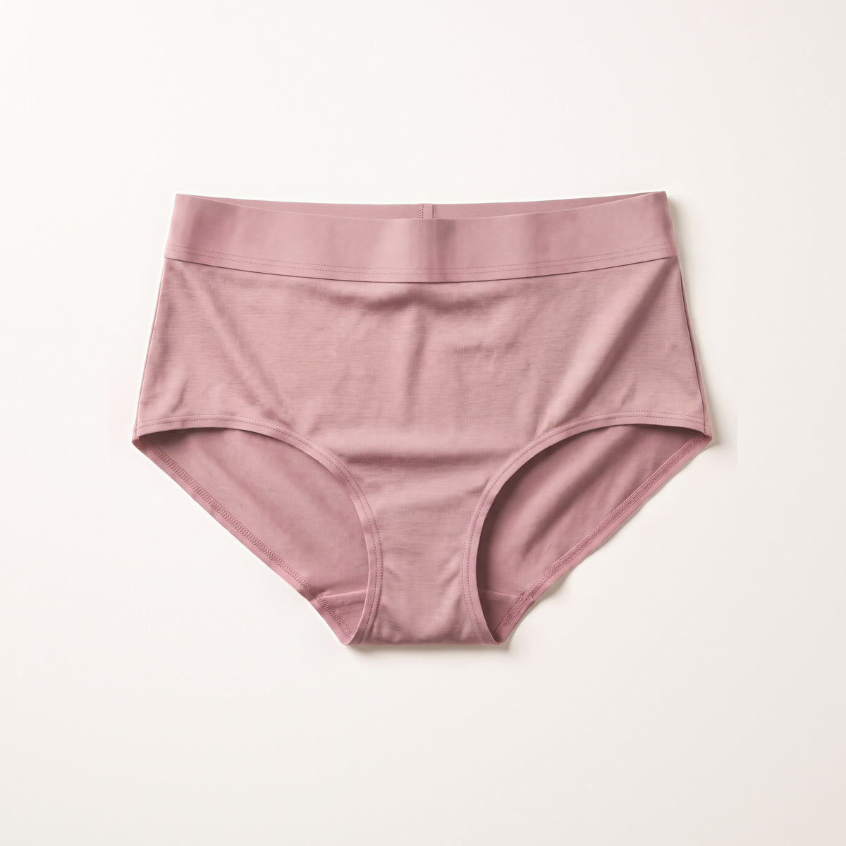 Slip assorbente LEIDRY™ Giorno rosa a vita alta, su fondo bianco